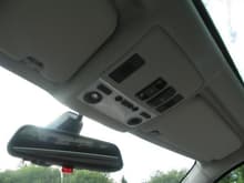Rear view mirror with garage door opener and alarm LED
