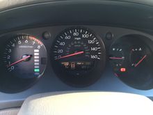 Hard to read, but 123090 miles and no warning lights on (that's the seat belt light on the right).