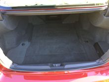 The trunk looks as though it was never used to store, or haul anything.  The trunk nets rest in the spare tire cover, and have never been used.