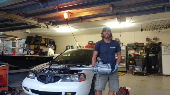 Here's a pic of my gay ass making love to the S\C before the installation. Before I installed the S\C I took it out for a spin to make sure that everything was fine. I don't know if it's because I haven't driven my car in months, but it felt very strong (fast)! I can't wait to see what the S\C does to it...