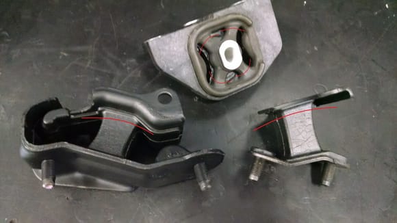 The upper (top) and lower (bottom) transmission mounts. Red lines indicate where they usually break.
