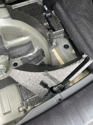 What can I use to glue this foam piece back into place? I see what looks like a yellow foam/glue that it looks like the factory maybe used. What is that?