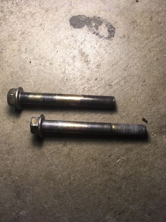 on top is one of the upper bolts and the bottom is the shorter lower bolt (you cant see the threads that it stripped out on it cause i cleaned it off)