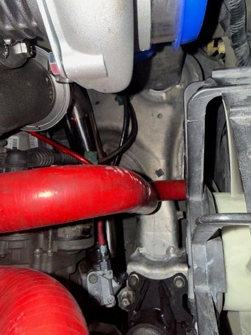 In this angle you can see how its routed under the front motor mount then up in front of the transmission and its about a 90 degree angle up to the turbo. All of the piping is 2.5