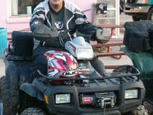 me sitting on the 700EFI at the pink store at bull gap.                                                                                                                                                 