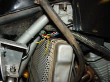 Tach green wire connects to the factory harness at the cdi box conector behind the oil tank.  cdi box wire has a yellow piece of string tied on it.  T                                                  