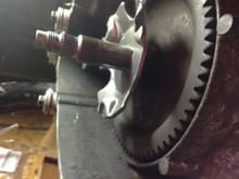 plate stopped by flared crankshaft