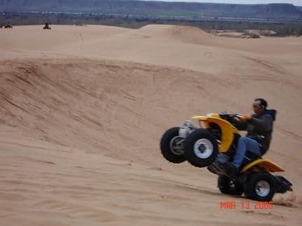 This is my dad doing a wheelie!!!