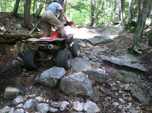 jgar climbing the rocks on his 400ex