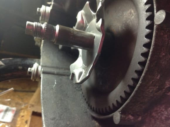 plate stopped by flared crankshaft