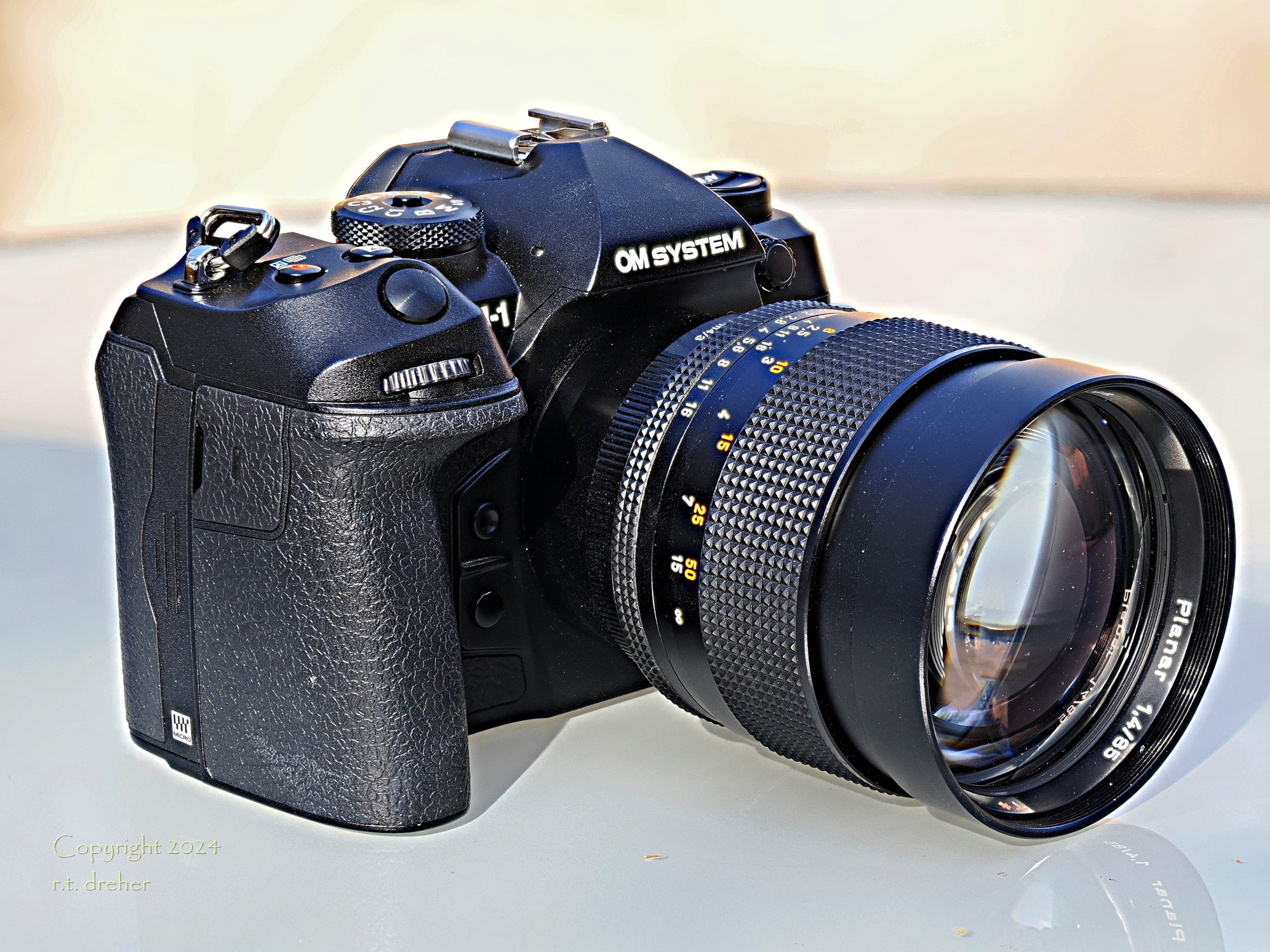 Zeiss Contax/Yashica mount 85/1.4 film lens adapted to modern digital MILC camera.