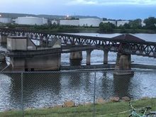 Example: This low-water dam forms Zink Lake on the Arkansas River, built under the old railroad bridge. 
