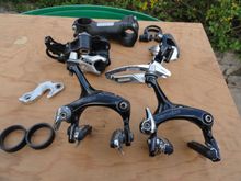 Spare parts to complete the build. Tektro brakes, spacers, dropout hanger, Deore XT rear, 105 Triple FD.  extra clamp for the seat post, and extra stem
