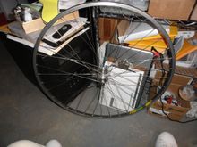 All laced up.  I started and found out halfway that the rim was on facing the left side of the bike, so I had to restart turning the rim around for a right facing logo for the wheel.  