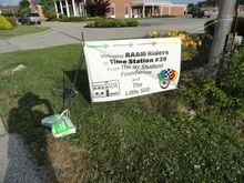 Signage in front of the station, with parking space for some teams for extended breaks.