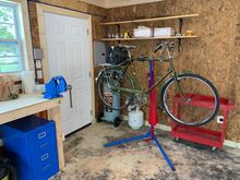 Looking from the garage door towards the back of the shop.  The door is the secondary door facing the back yard.  The main rear door is on the opposite wall facing this one.