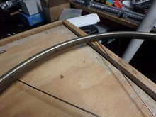 Our first spoke is the one on the left, the second spoke in place on the flange will go around the rim in the fourth hole from our first spoke.