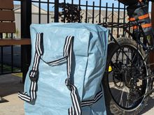 Really handy Ikea bag/backpack. Big enough to hold 2 x 17 liter panniers + 2 x 4.1 liter fork bags + ~10 liter drybag + misc