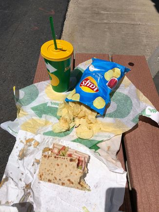 Lunch outside in the sun on a bench.