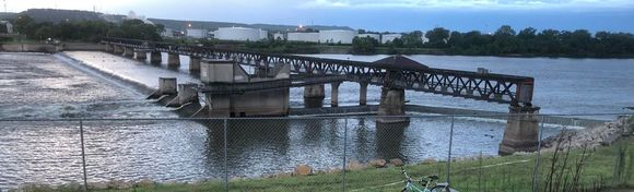 Example: This low-water dam forms Zink Lake on the Arkansas River, built under the old railroad bridge. 
