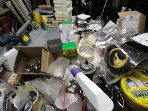 The work bench wit way too many items on it.  Does anyone see the 8mm wrench anywhere?
