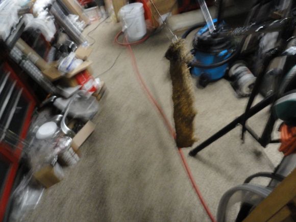 The oil cloth on a wire used to oil the insides of the tubes.