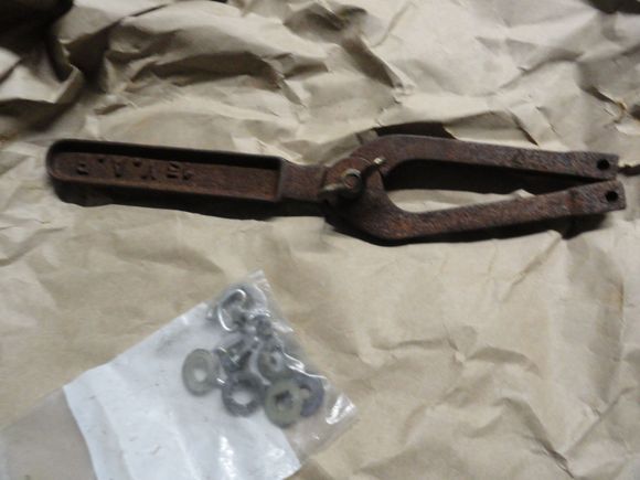 Rust encrusted pin spanner.  First some ATF/acetone in the pins for removal, and then a long bath in some oxalic acid.