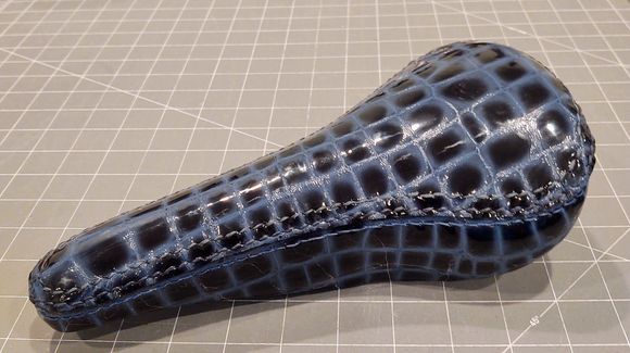 The final product.  I used cowhide stamped to look like aligator.  Because it is not as stretchy, I made it two pieces, a top with an attached skirt.  The stitching the seam are not felt when riding.