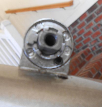 Left shifter.  Note the set screw. Note the cable entry via the frame..This is a friction shifter, but it uses the insets on the backing plate just the same.
