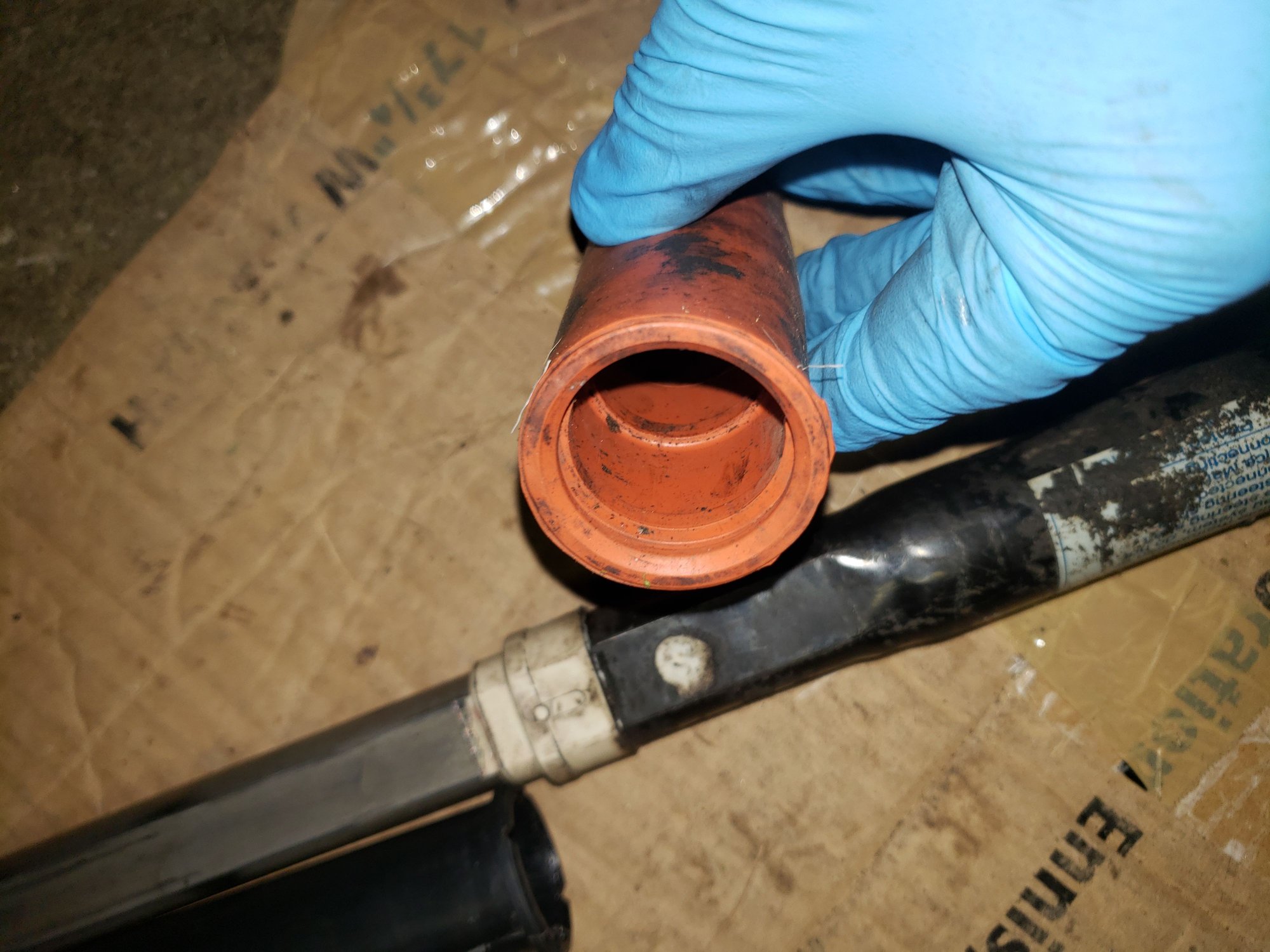 The lip in the inside of the orange rubber cover on the lower intermediate shaft.