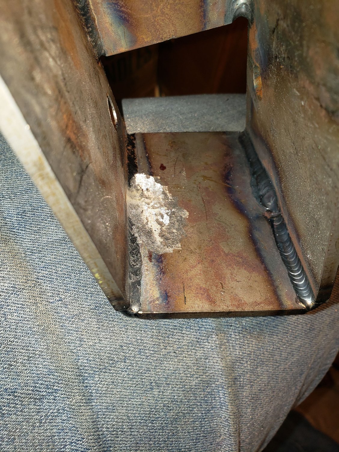 The final product of the grinding away of the bracket for the idler arm pivot.