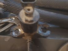 The evap purge solenoid the ears are crushed. Also one of the 10 hold downs was gone so I guess extra torque was needed