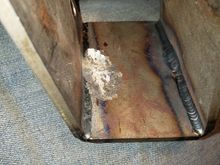 The final product of the grinding away of the bracket for the idler arm pivot.