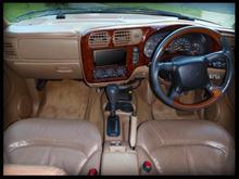 My BLAZER 2000 LT RIGHT HAND DRIVE 22'' BLING RIMS
 tan leather and walnut dash trim..