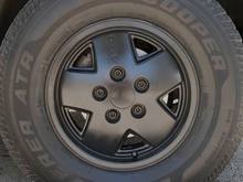 Black rims (after I painted them) with Cooper Discoverer ATR 235/75R15XL (extra load) M S tire