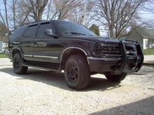 spring clean up. I painted the stock rims with semi-gloss rustoleum spray paint, and I also painted the grill also. I also added coil overload shocks on the rear to level it out.