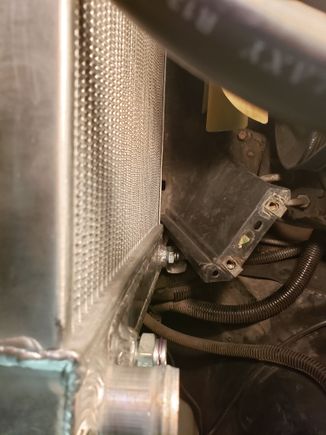 Another picture showing how the lower shroud mounting is too narrow for the base of the new radiator.

