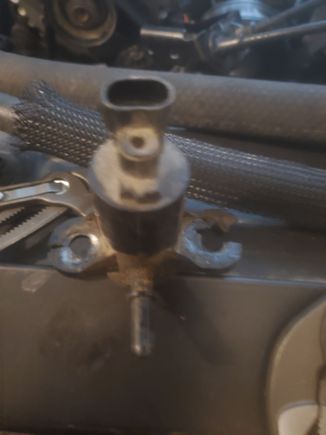 The evap purge solenoid the ears are crushed. Also one of the 10 hold downs was gone so I guess extra torque was needed