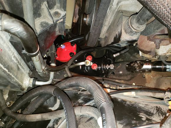 The steering gear installed and about to attach the hoses. Be sure to chase or clean the threads on the steering gear to get rid of any accumulated paint. I had a hard time getting the fittings started and I was fearful of stripping the threads.