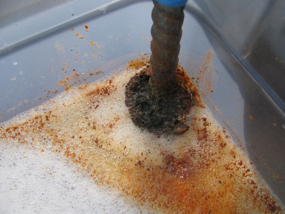 Working at pulling Rust from part.