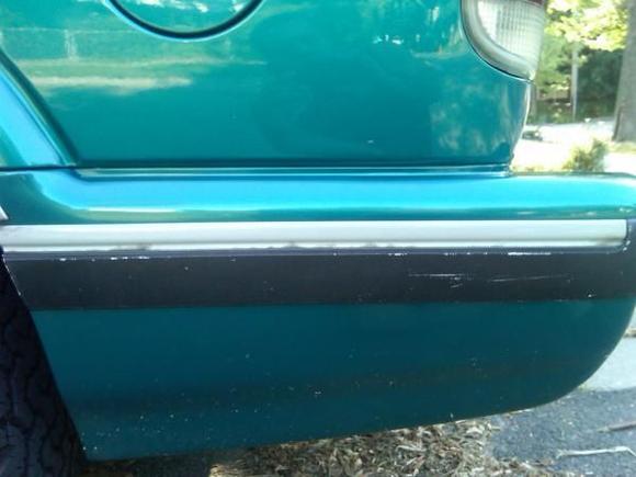 Worked on replacing the silver part on this two piece body moulding by using silver lower door panel guard (outer) and wrapped it around the silver part of the trim and reattached it with 3-M double faced tape. On the rest of the body trim, I had to cut the silver part off (you have to pull the entire trim piece off,remove old adhesive tape from body and the trim) and wrapped it the same way there is about an 1/8 of an inch that is on the back of the trim. I wrapped it that way to keep out water, dirt and salt. It is a little tricky, but its well worth the results. Only time will tell how it holds up !