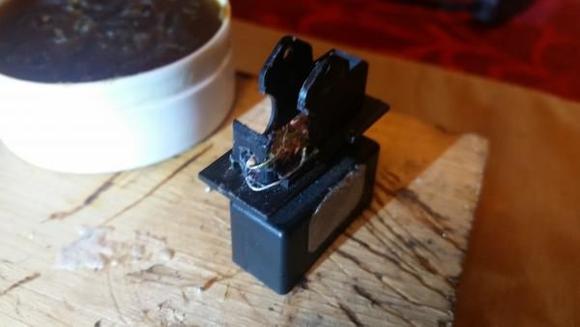 On this led, the leg with the brown resistor was negative? ( Before soldering it would be wise to test it in the door first to make sure of correct polarity for your led to light up on this one)and went to the closest metal contact. Then the other leg ran to the opposite metal contact. Made sure the legs would never make contact with each (avoiding a ground out) by first using a screwdriver to keep them as close and flush to the body and base as possible then after soldering them permanently into position ; I hot glued all around the metal legs so they wouldn't bump into each other,ever.