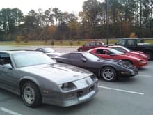 camaro, vette (C4), 4th gen, and exclipse... the owners of the vette and eclipse are dating so i had to get her in the picture lol