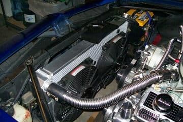 New radiator with 2 electirc fans controlled by independent manual switches on the dash.