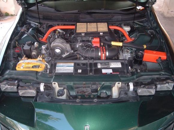 This is a older picture of the engine bay, but it hasn't changed much since this.  Only the addition of some BBK headers, and bigger wireing for the stereo ran to the battery.  Notice the BMR STB, that alternator is a 250 amp version, and of course the SLP ram air box.