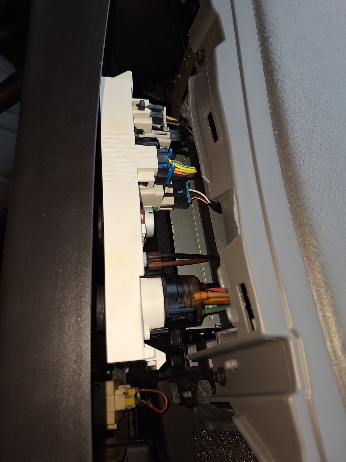 Pull back the control assembly for access