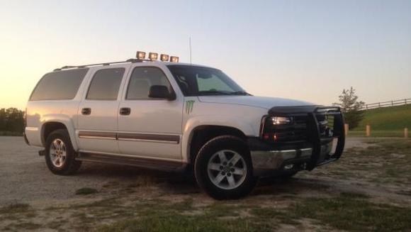 My suburban now has blacked out headlights brush guard and roof lights tell me what you think