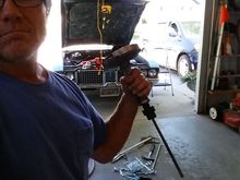 Note the necessary tools of destruction: hammer drill, steel rods, and 36" crow bar, among others.