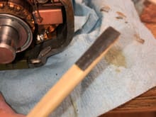 Glued sandpaper to a sliver of a paint stick