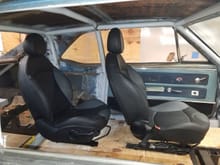 Custom hunk of plywood floor and checking the leg room front to rear.  I would like to see a bit more foot room for the rear seats.  May end up modifying the back rests so the seats can go back a few more inches.